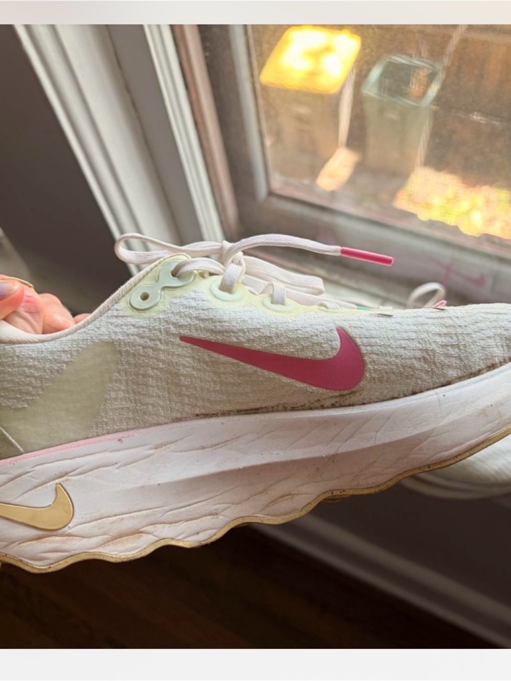 Nike Cream Athletic Sneakers with Pink Swoosh and Gold Accents